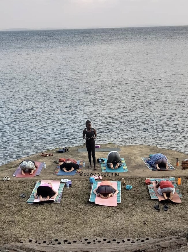 event: Stellah Patience: leading a class at a past retreat.  IG @poweryogajinja - Self-Care Retreat: Yoga Meditation Pilates Nutrition 
